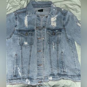 Distressed denim jacket. Size M